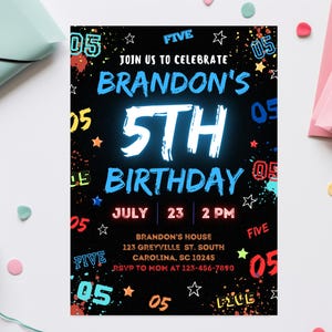 May include: Black and white birthday invitation with neon blue and red accents. The invitation says "Join us to celebrate Brandon's 5th Birthday" with the date and time of the party. The invitation is decorated with paint splatters and the number "05" repeated throughout.