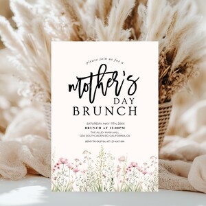 May include: White invitation card with black text that reads "Please join us for a mother's day brunch" with the date and time of the event, "Saturday, May 11th, 20XX, Brunch at 12:00PM", the location, "The Alley Main Hall, 1234 South Jaden Rd, California, CA", and the RSVP information, "RSVP to Olivia at 123-4567-890". The bottom of the card features a watercolor illustration of pink and white flowers.