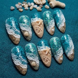 May include: Ten artificial nails with a beach theme. Each nail features a design of ocean waves, sand, seashells, and a starfish. The nails are painted in shades of teal, white, and tan, with intricate details.