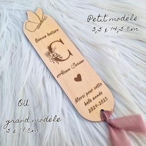 May include: A wooden bookmark with a butterfly design at the top, measuring 3.5 x 14.5 cm. The bookmark features the text "Bonne lecture", a floral "C", the name "Atsem Corine", a heart, and the text "Merci pour cette belle ann&eacute;e 2024-2025".