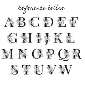 May include: Black uppercase alphabet letters, each adorned with floral embellishments. The letters are arranged in rows and columns against a white background. The text "R&eacute;f&eacute;rence lettre" is written above the letters.