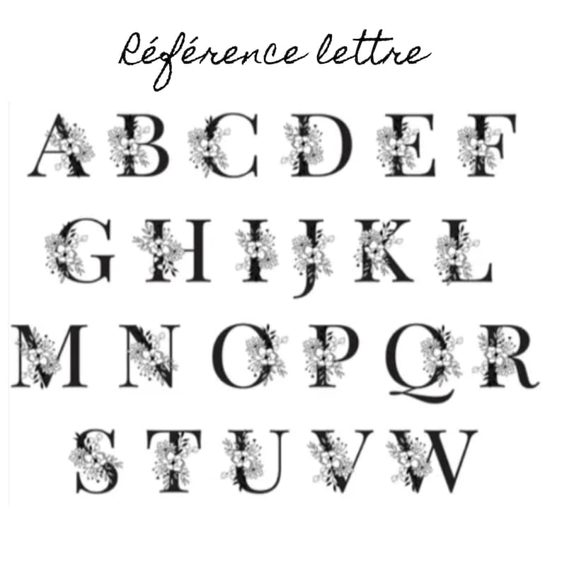 May include: Black uppercase alphabet letters, each adorned with floral embellishments. The letters are arranged in rows and columns against a white background. The text "R&eacute;f&eacute;rence lettre" is written above the letters.