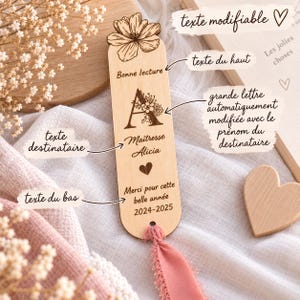 May include: A light-colored wooden bookmark featuring a laser-engraved flower at the top, the text Bonne lecture, a large letter A with floral details, the name Maitresse Alicia, a heart icon, the text Merci pour cette belle ann&eacute;e, and 2024-2025.