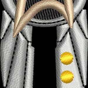 May include: Embroidered patch featuring a silver and tan delta-shaped emblem with a black background. The emblem has a silver border and three gold dots on the lower right side. The design is detailed and textured.