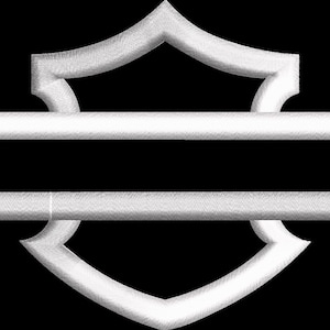 May include: White embroidered emblem with a shield shape above and below a rectangular space, all against a black background. The emblem has a textured, stitched appearance.