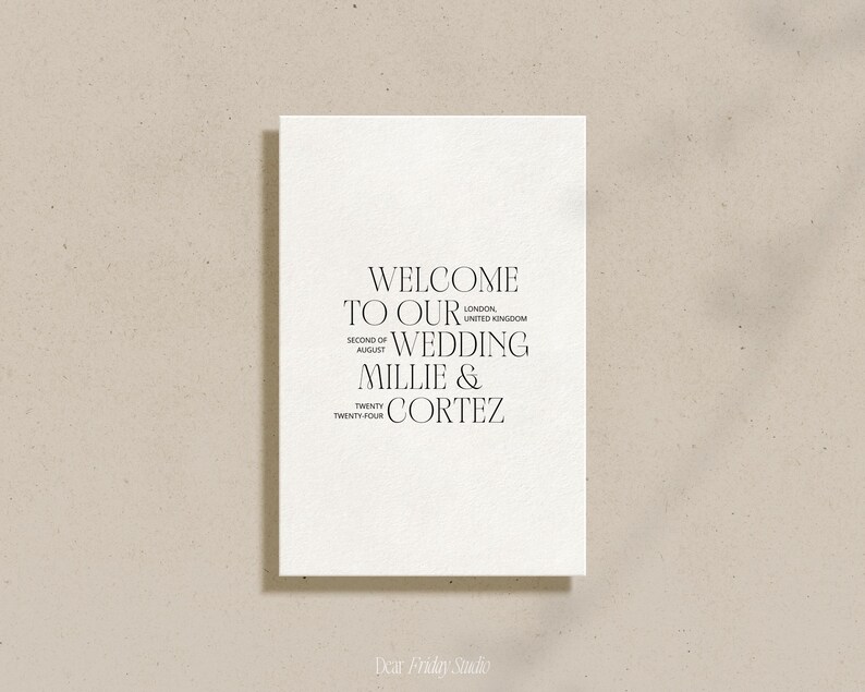 May include: A white card with black text that reads "Welcome to our wedding Millie & Cortez" with the date "Second of August Twenty Twenty-Four" and the location "London, United Kingdom".