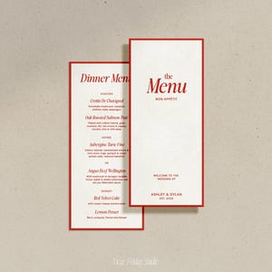 Peut inclure: Un menu de mariage avec une bordure rouge. Le menu comprend une liste d'entrées, de plats principaux et de desserts. Le texte du menu indique "Dinner Menu", "the Menu", "Bon Appetit", "Bienvenue au mariage d'Ashley & Dylan, Est. 2028".