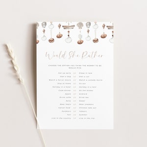 May include: A printable "Would She Rather" game with a beachy theme. The game features a list of questions with two options each, such as "Get up early" or "Sleep in late". The background of the game is a watercolor illustration of seashells and driftwood.