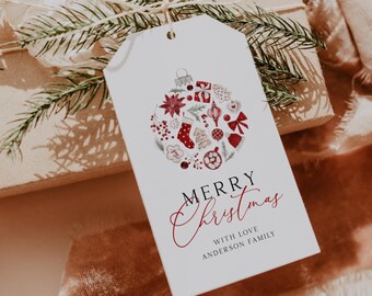 May include: White gift tag with a red and white watercolor illustration of a Christmas ornament with a variety of holiday decorations. The text "Merry Christmas" is written in black with "With Love Anderson Family" in red below.