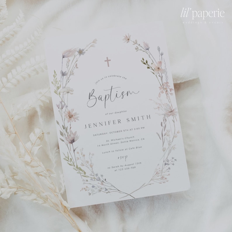 May include: A white baptism invitation with a watercolor floral wreath and a cross. The text reads "Join us to celebrate the Baptism of our daughter Jennifer Smith, Saturday, October 8th at 2:00 PM, St. Michael's Church, 14 North Street, Santa Monica, CA, Lunch to follow at Cafe Blue, RSVP to Sarah by August 15th at 123-456-788".