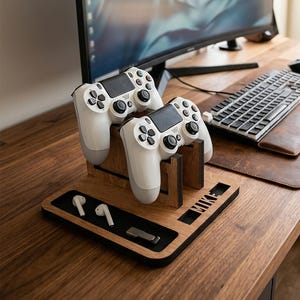 May include: A wooden gaming controller stand with a black base, designed to hold two white game controllers. The stand features a cutout with the name MIKE, and a recessed black tray containing a pair of white wireless earbuds and a small metal USB drive.