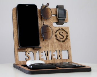 May include: Wooden organizer with slots for a phone, watch, sunglasses, and other items. The organizer has the name "STEVEN" engraved on the front and a monogrammed "S" in a wreath.