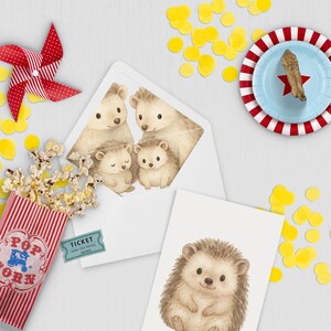 May include: A whimsical scene with a red and white pinwheel, popcorn in a striped container, and a blue plate with a red star. The image features a white envelope with a family of hedgehogs and a card with a single hedgehog illustration.