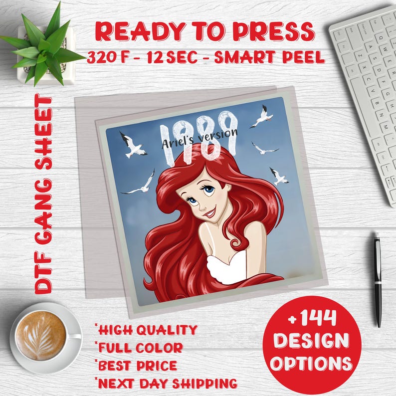May include: A ready-to-press iron-on transfer sheet featuring a cartoon image of Ariel from The Little Mermaid. The image is set against a blue sky with seagulls flying overhead. The text "Ariel's version 1989" is included in the design.