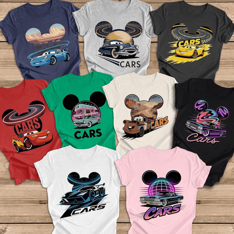 May include: A selection of t-shirts with car-themed graphics. Each tee displays a unique car illustration, with the word "CARS" included. The shirts are available in a range of colours, such as navy, grey, red, green, white, black, and pink.