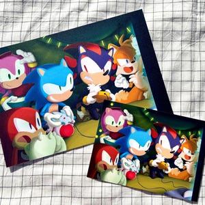May include: A digital illustration of six characters from the Sonic the Hedgehog franchise playing a video game. The characters are Sonic, Shadow, Knuckles, Tails, Amy, and a white rabbit. The characters are in a dark room with green and yellow lights.