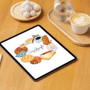May include: A digital tablet displaying a colorful illustration of various sourdough bread loaves and other baking ingredients. The text "Sourdough Recipes" is featured in the center of the illustration.