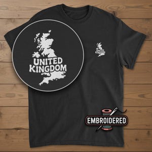 May include: A white ceramic mug with a black handle and the text "But First, Coffee" in a black, bold font. The mug is on a white surface.