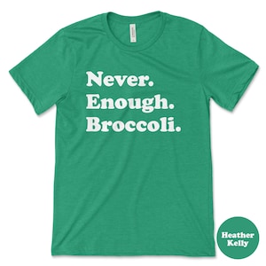 May include: Green t-shirt with white text that reads "Never. Enough. Broccoli."