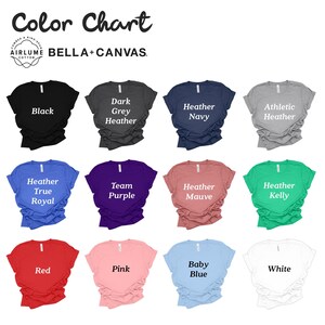 May include: Color chart showing 12 different t-shirt colors. The colors are: Black, Dark Grey Heather, Heather Navy, Athletic Heather, Heather True Royal, Team Purple, Heather Mauve, Heather Kelly, Red, Pink, Baby Blue, and White.