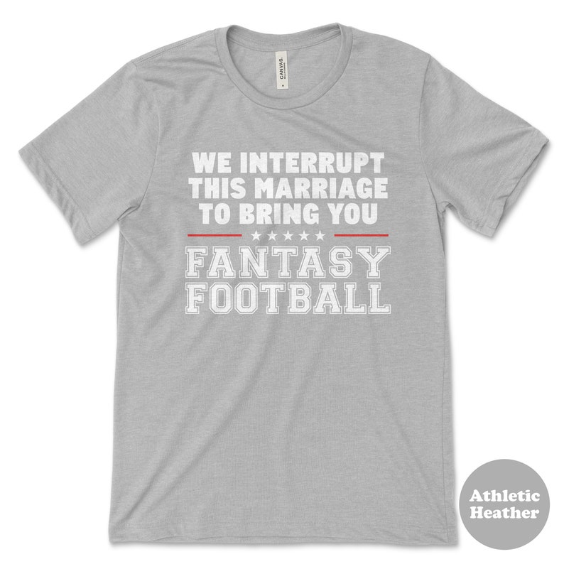 May include: Grey t-shirt with the text "We interrupt this marriage to bring you Fantasy Football" in white letters with a red line above and below the text.