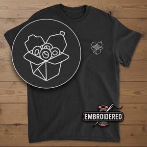 May include: Black t-shirt with a white embroidered design of a takeout box filled with food. A larger, circular version of the design is on the left. The word "EMBROIDERED" is below the design.