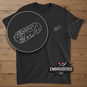 May include: Black t-shirt with a white embroidered burrito design. The shirt features a large, detailed burrito graphic and a smaller version on the chest. The word "EMBROIDERED" is printed below the shirt's hemline.