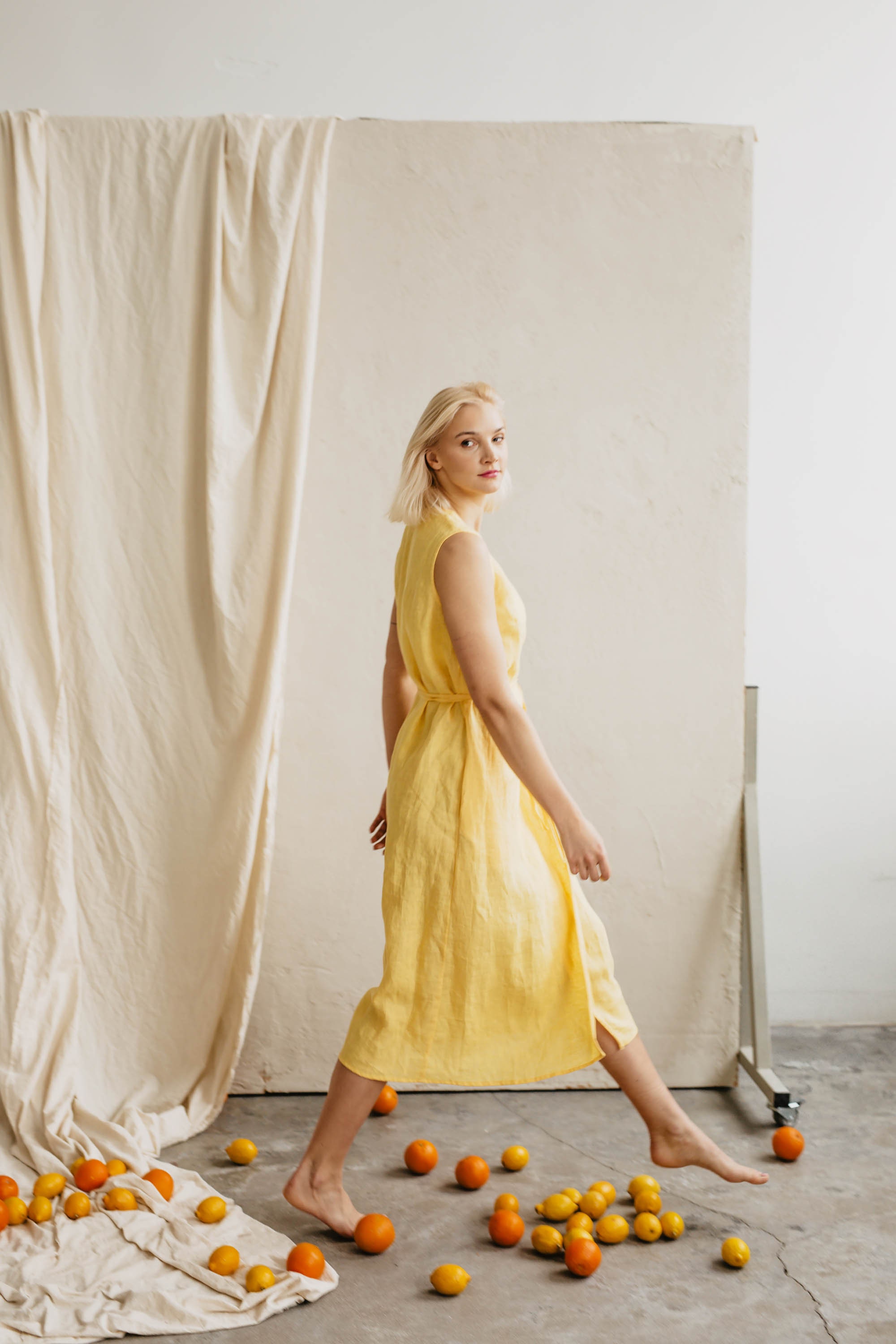 Women's linen dress SALOMĖJA. Classy sleeveless wrap dress. Mid-length linen dress in Sunshine Yellow. Vintage inspired linen dress.