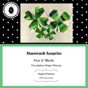 May include: Four green and white fabric shamrock quilt blocks, each approximately 6 inches. The blocks are arranged on a light surface. The text "Shamrock Surprise" and "Digital Pattern PDF Download" are also visible.