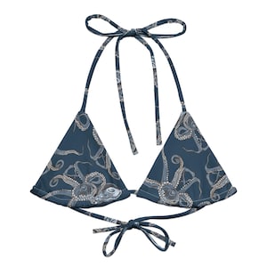 May include: A blue triangle bikini top with an octopus print. The top has adjustable straps and ties at the back.
