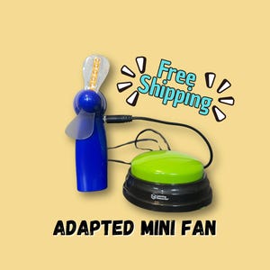 May include: A blue handheld mini fan with clear blades connected by a black cord to a round black base with a large lime green button on top. The text ADAPTED MINI FAN is printed below the device, and the words Free Shipping appear above.