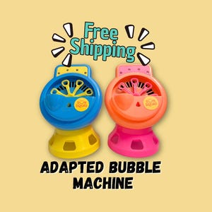 May include: Two colorful bubble machines, one blue and yellow, the other pink and orange, are displayed against a yellow background. The text "ADAPTED BUBBLE MACHINE" is printed in bold black letters at the bottom.