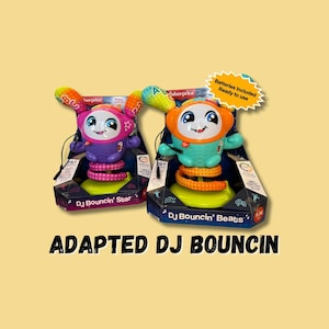 May include: Two Fisher-Price DJ Bouncin' toys, one blue and one purple, with a springy base and a microphone. The toys are packaged in boxes with the text "DJ Bouncin' Star" and "DJ Bouncin' Beats". Batteries are included.