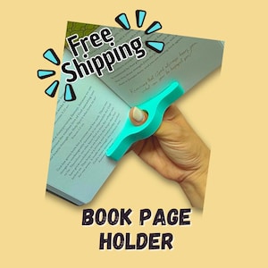 May include: A teal book page holder is shown, holding open a book. The holder is shaped to fit over a finger, with the text "BOOK PAGE HOLDER" at the bottom. The words "Free Shipping" are also visible.