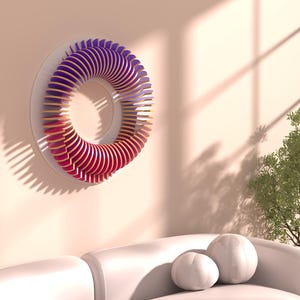 May include: A modern wall art piece featuring a circular design with layered wooden elements. The artwork transitions from red to purple hues. It is mounted on a white disc against a peach-colored wall. The piece adds a contemporary touch to any living space.