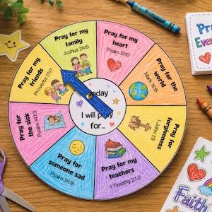 May include: A vibrant prayer wheel featuring sections for different prayer intentions, with illustrations and Bible verses. Crayons, stickers, and a notepad with "Pray Everyday!" are also visible. A fun, educational craft.