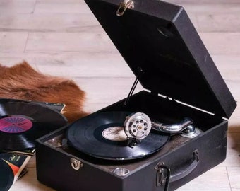 The Timeless Dance of Sound: Antique Briefcase Gramophone, Bringing Nostalgic Melodies to Life.