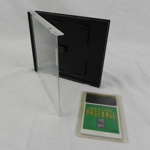 May include: A clear plastic game case with a black backing and a video game cartridge. The cartridge has a green and white label that reads "WORLD CLASS BASEBALL TURBO GRAFX". The case is open and the cartridge is in a clear plastic sleeve.