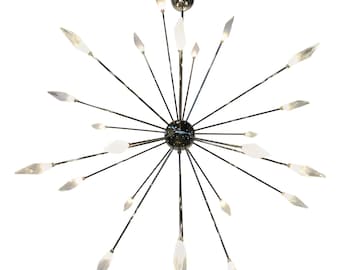 May include: A modern chrome chandelier with multiple crystal-like points extending outwards from a central sphere. The chandelier has a starburst design.