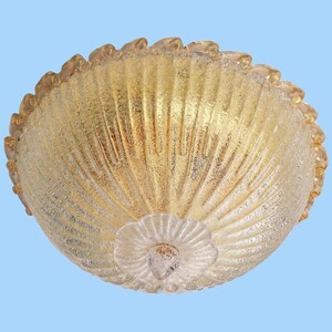 May include: A gold-toned glass ceiling light fixture with a scalloped edge and a textured, ribbed design.