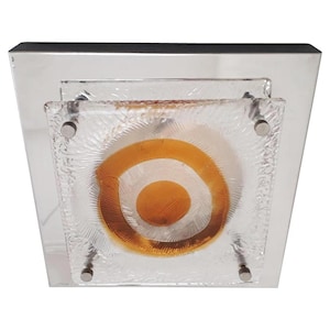 May include: A square ceiling light fixture with a chrome frame and a frosted glass shade with a concentric circle design in shades of orange and white.