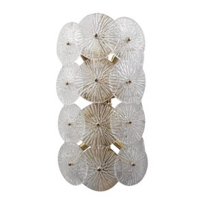 May include: A decorative wall sconce featuring a series of clear, circular glass elements with radial patterns. The glass circles are arranged in a vertical column and are connected by a gold-colored metal frame. Each glass element has a small, gold-colored center.