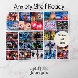 May include: A sheet of stickers with book covers, labeled "Anxiety Shelf Ready." The stickers feature various book titles and authors, including Brandon Sanderson and Jim Butcher. A circular sticker reads "Stickers with spine."