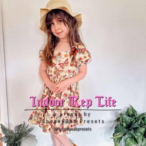 May include: A young person wearing a beige dress with a butterfly pattern, a straw hat, and a butterfly accessory. The dress has short sleeves and a ruffled hem. Text on the image reads "Indoor Rep Life" and "a preset by Spooky Sab Presets @spookysabpresets."