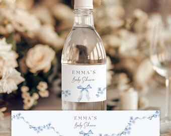 May include: Water bottle label with a blue ribbon and floral design. The label says "Emma's Baby Shower".