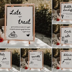 May include: A set of ten wedding signs with black calligraphy on white backgrounds. The signs are displayed on wooden easels and include phrases like "Late Night Treat", "Bubble Sendoff", "Cards & Gifts", "Date Jar", "Sparkle", and "Advice & Wishes".