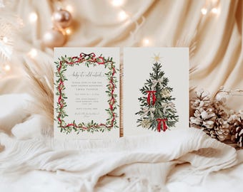 May include: A two-piece baby shower invitation set featuring a white card with a mistletoe and red ribbon border, text reading Baby it's cold outside, and a second card displaying a watercolor Christmas tree with red ribbons and a gold star.
