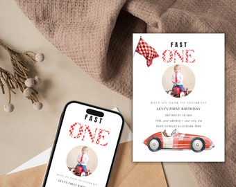 May include: A red and white checkered birthday invitation with the text "FAST ONE" in red and white. The invitation features a photo of a baby boy in a white shirt and red tie, sitting on a red toy car. The invitation also includes a red toy car with a white stripe and a checkered flag.