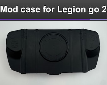 May include: Black mod case for Legion go 2. The case has a rectangular shape with rounded edges and integrated controller-like features on each side. The center features a circular design. The text "Mod case for Legion go 2" is at the top.