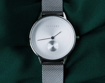 Reloj plateado para hombre Banda de malla con esfera plateada minimalista o banda de cuero Paradox